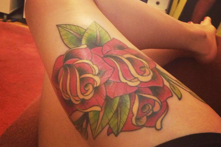 upper thigh rose tattoo