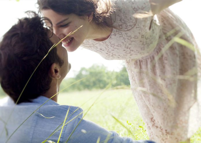 Smiling in middle of the kiss