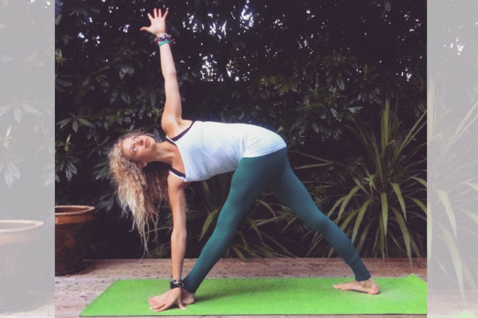 Trikonasana or triangle pose