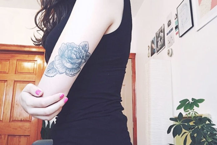 Grayscale arm rose tattoos