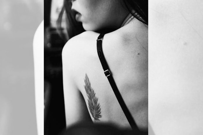 Single feather Tattoo