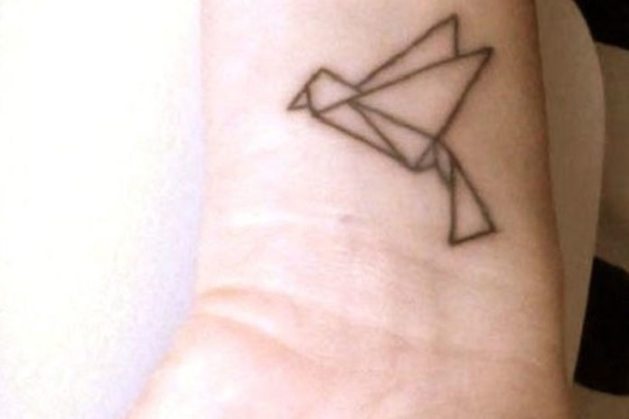 Tiny paper bird tattoo