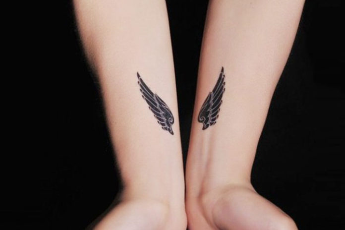 Angel wings on wrist