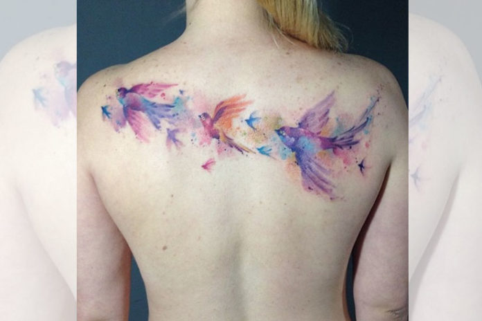 Watercolor Bird Back Tattoo