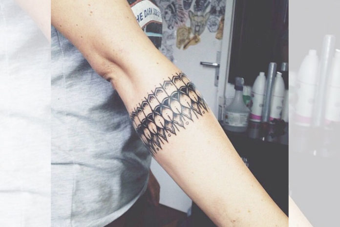 Arm bracelet tattoo