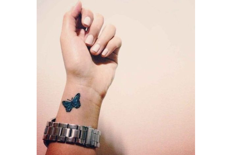 Tiny-butterfly-tattoo-On-finger