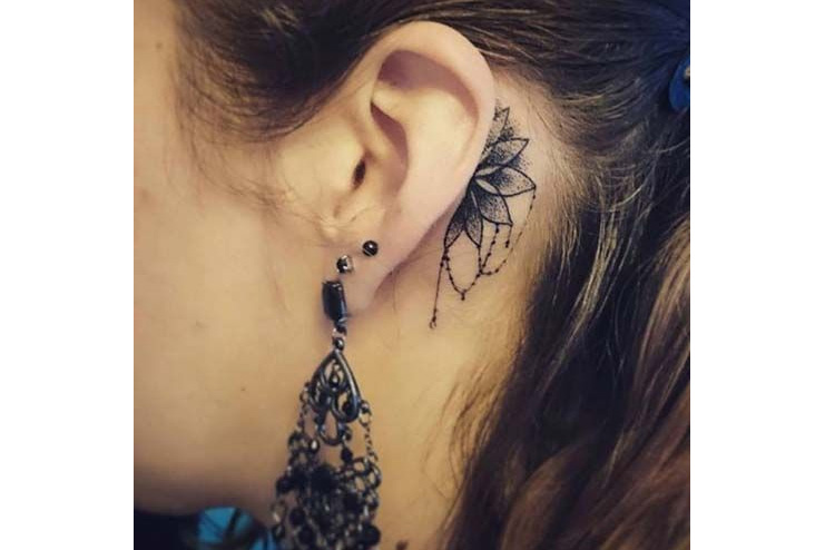 Intricate-ear-tattoo